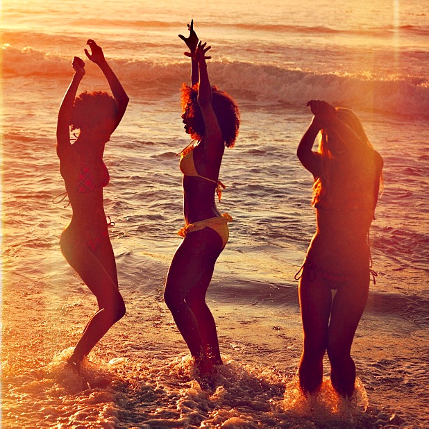 Girls dancing in some beach in Ibiza with the music of Bassofondo DJ Set by Rafa Peletey